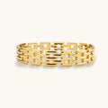 Wide 18K gold plated stainless steel bracelet with a multi-row rectangular grid link chain pattern on a cream background.